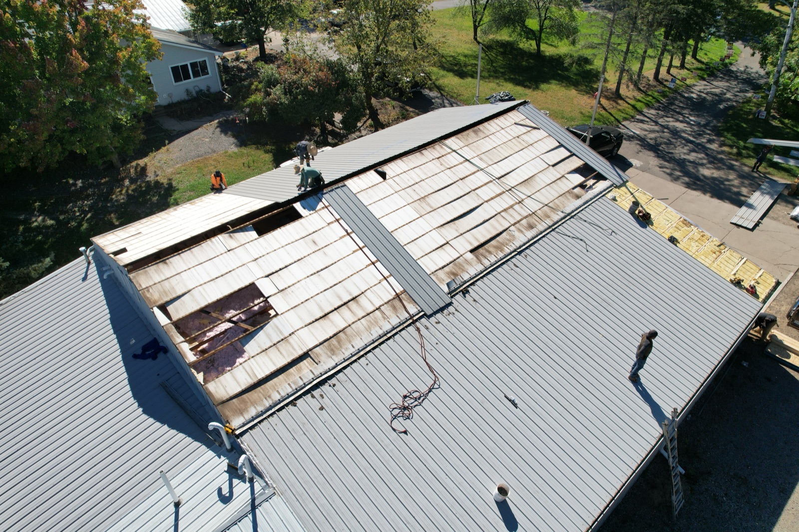 Standing-seam metal roof installation in progress