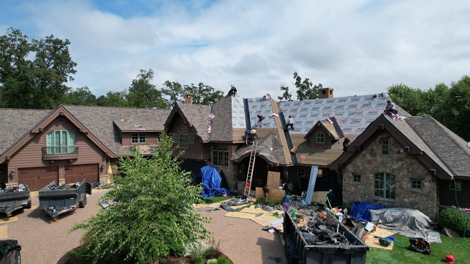 Roofing project with materials staged on site