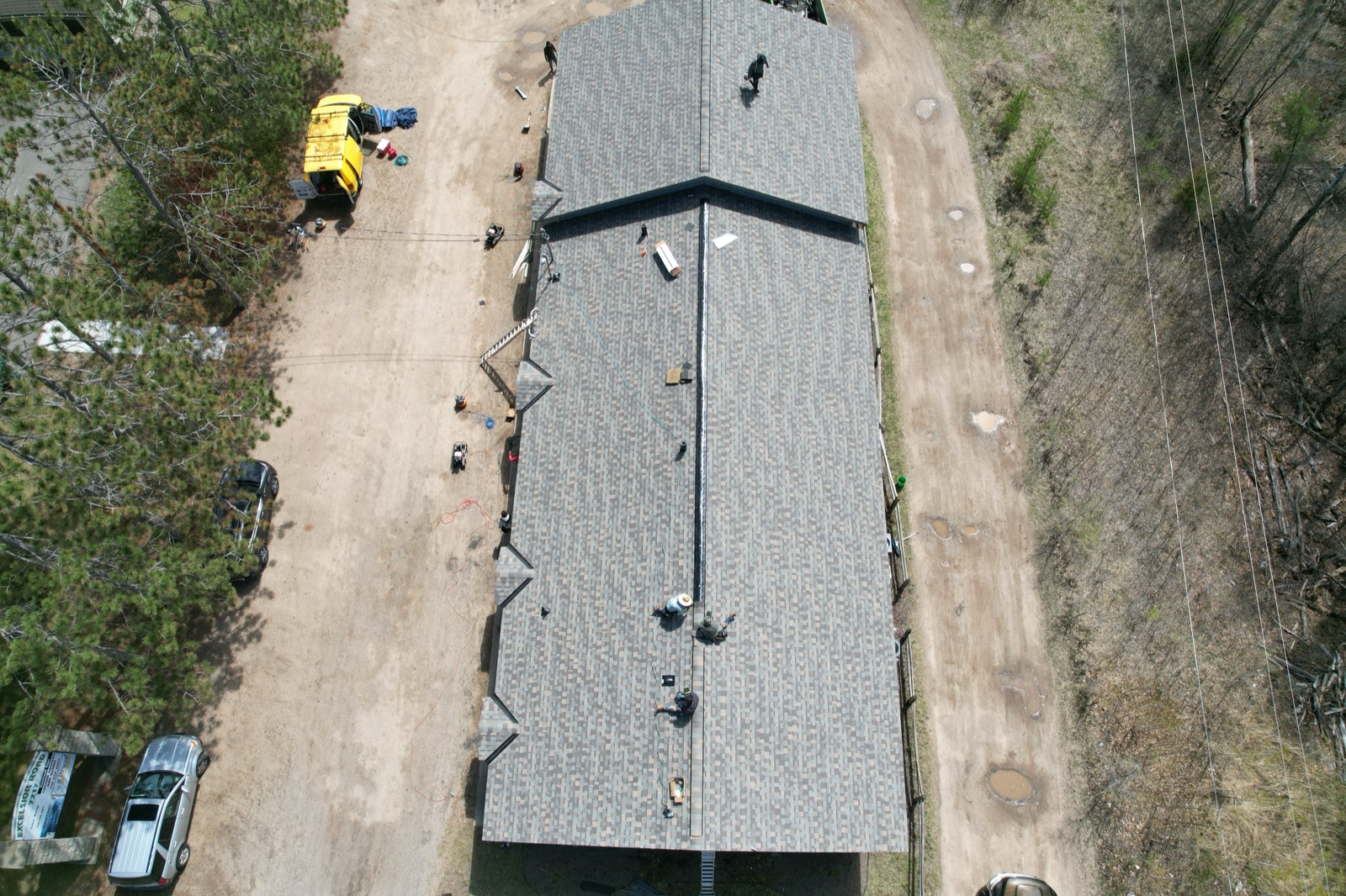 Storm-damaged roof tear-off underway