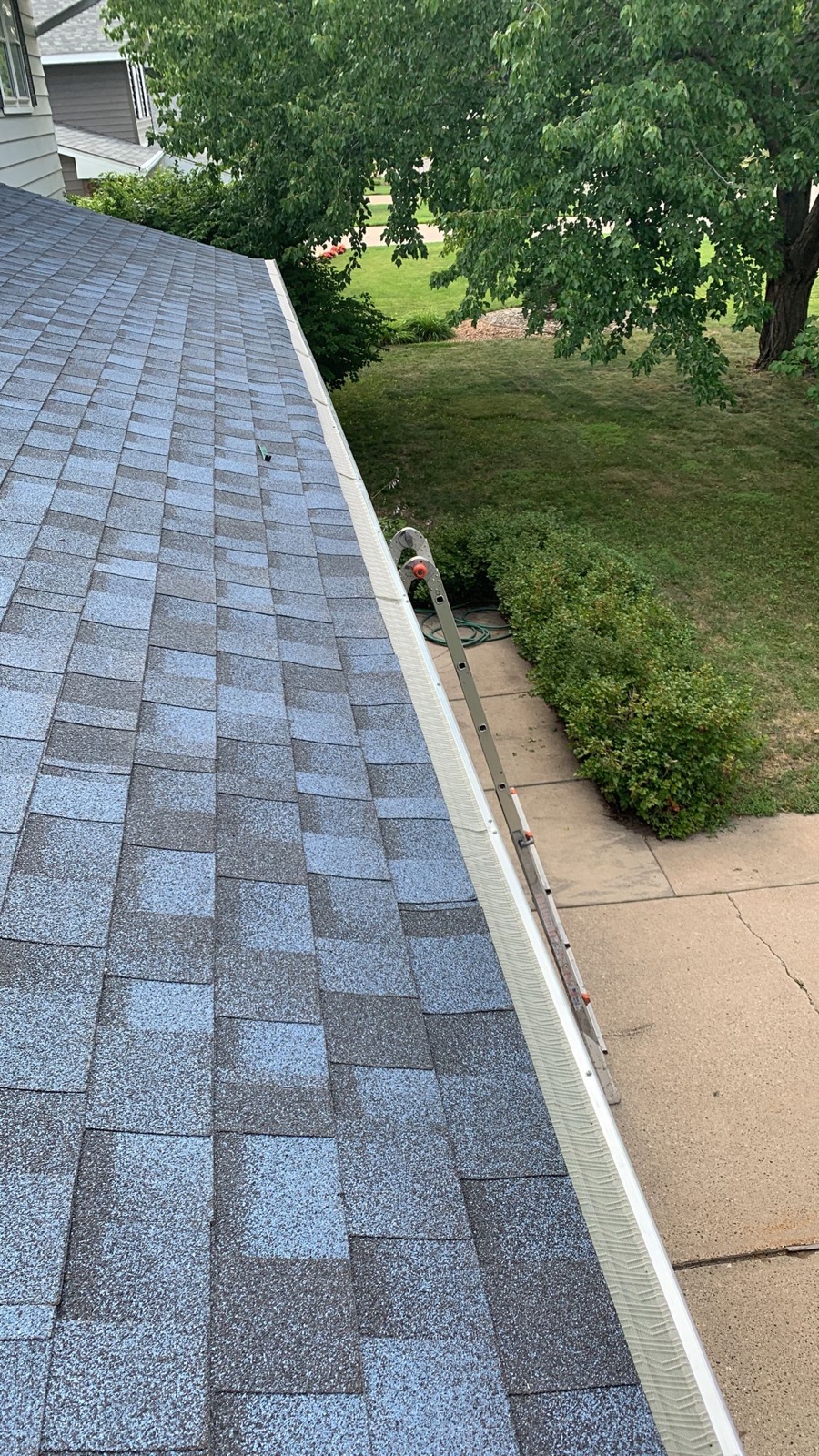 New seamless gutter run along a completed roofline